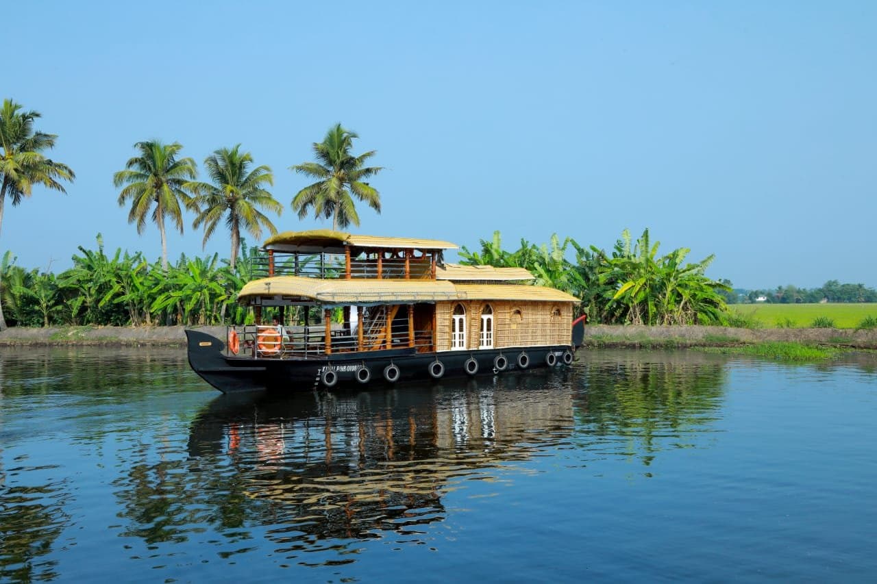 Deluxe houseboat interior in Alleppey Kerala backwaters for family stay